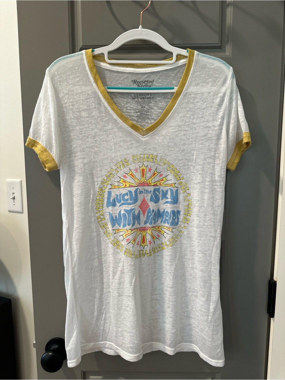 Recycled Karma White V-Neck Tee with Mustard Trim and Blue Graphic